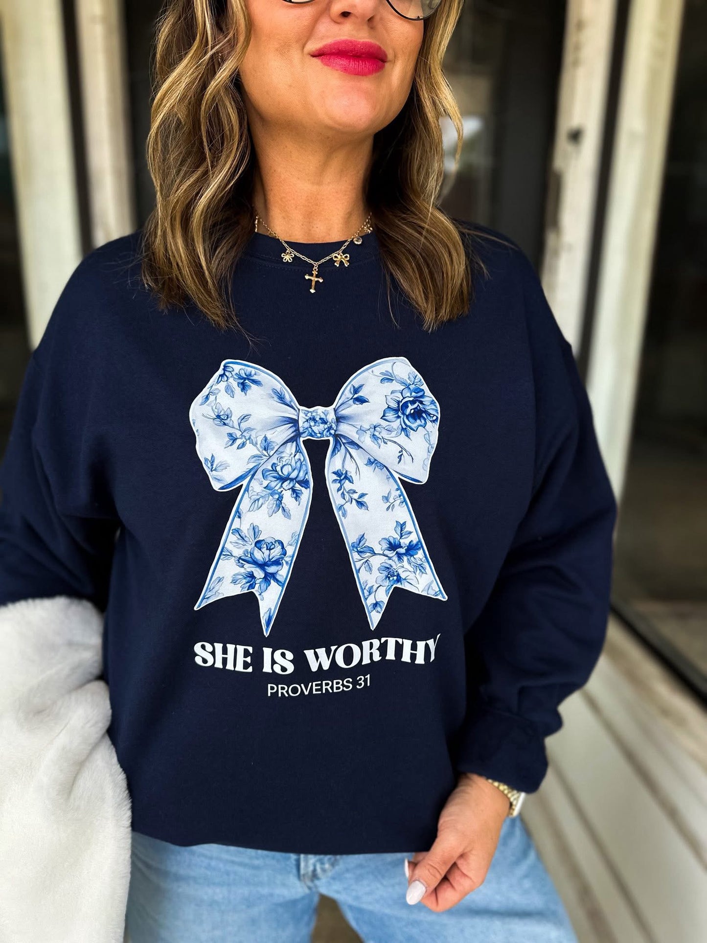 SHE IS WORTHY