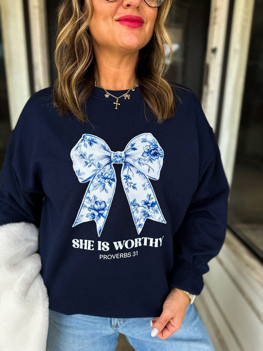 SHE IS WORTHY